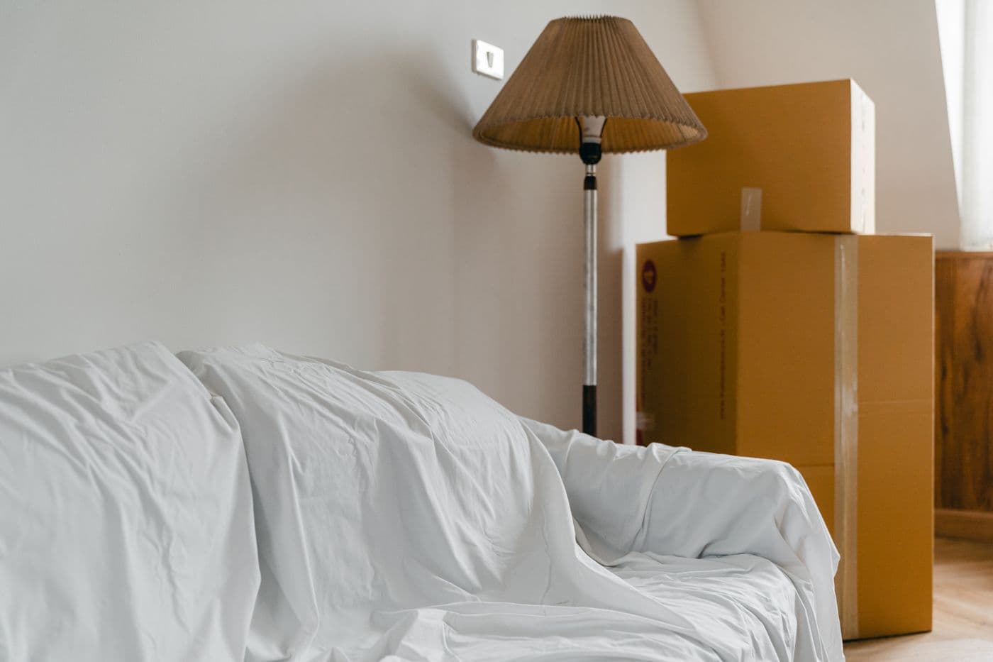 Furniture and boxes ready to be cleared from a room